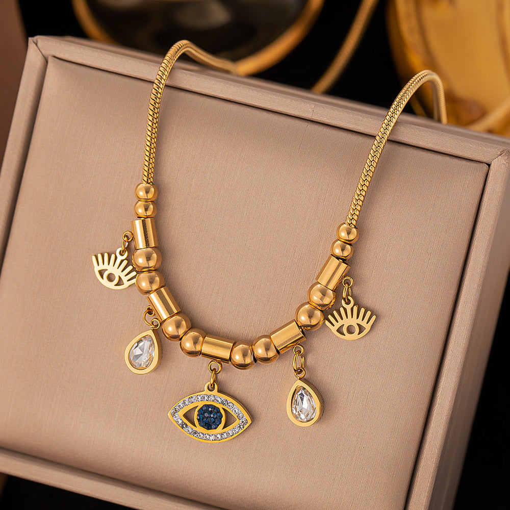 Collar con colgante de piedra romana dorada de 18 quilates de acero titanio al por mayor